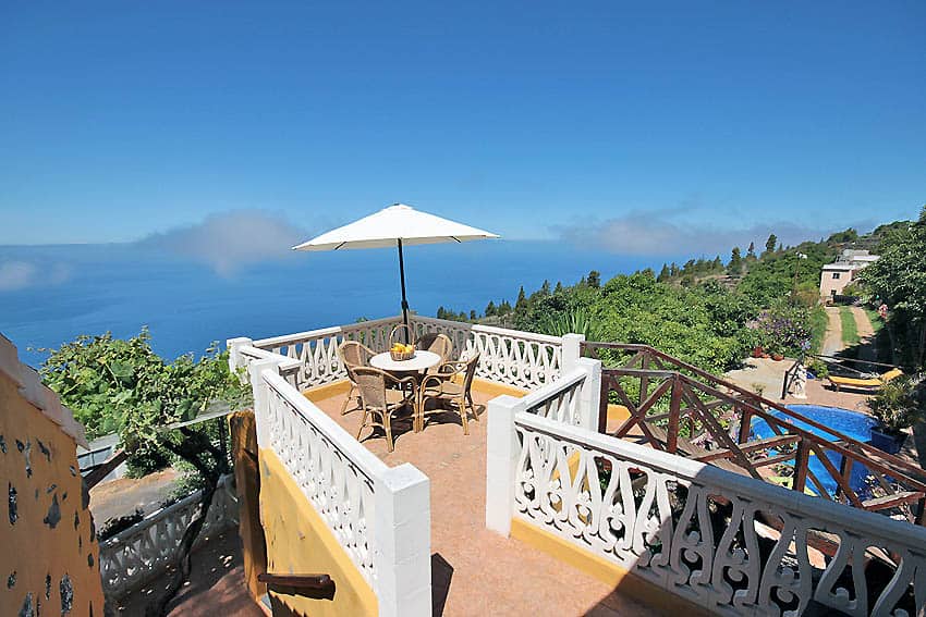 Small terrace with garden furniture and sweeping views to the sea